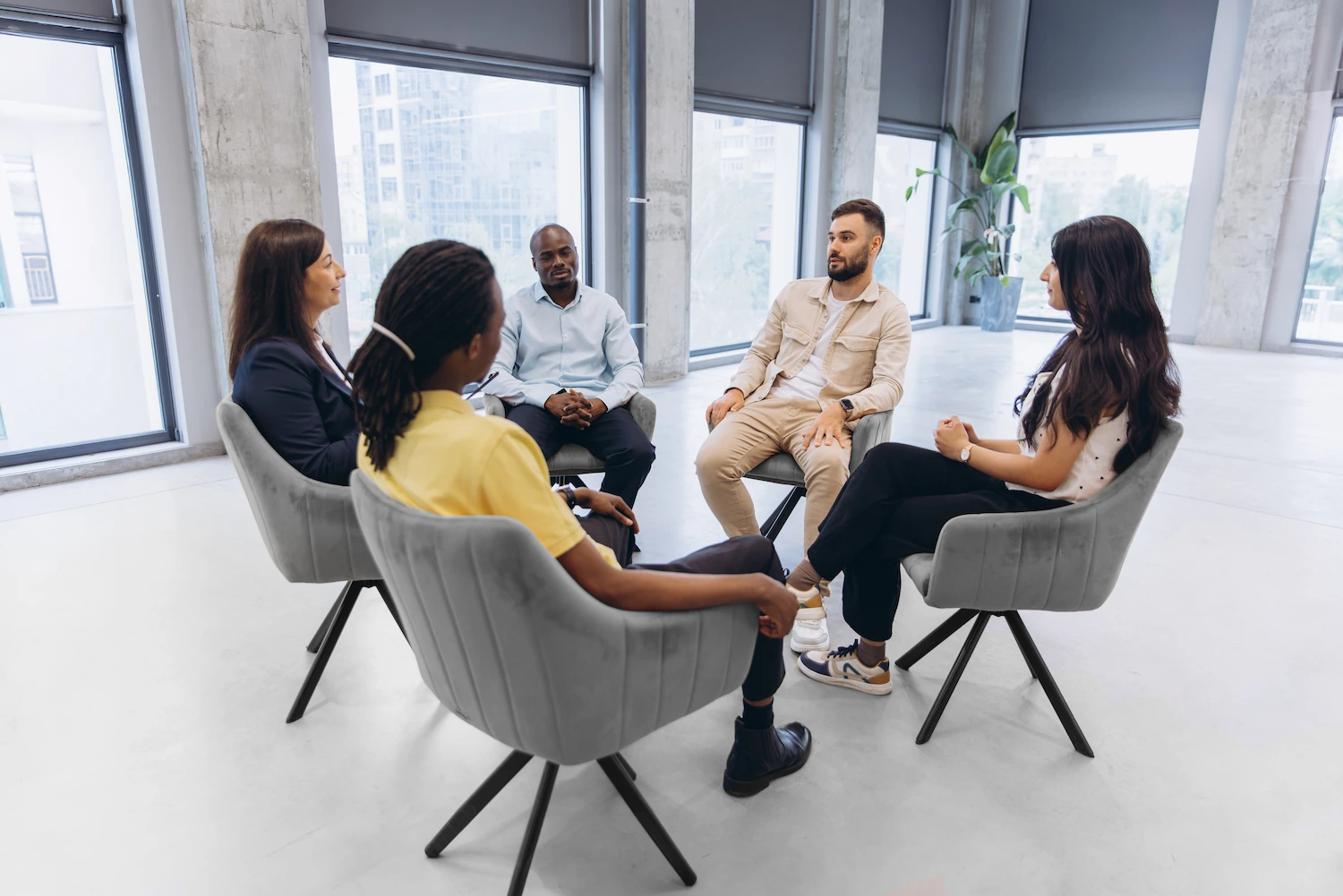 Adults in a small group session during an intensive outpatient program near West Palm Beach