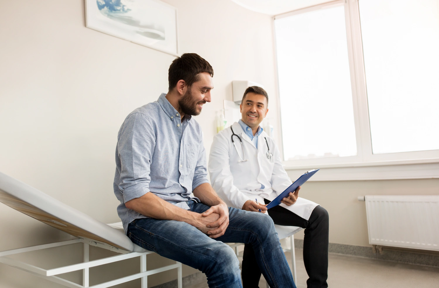 Physician discussing medication-assisted treatment options with a patient in recovery