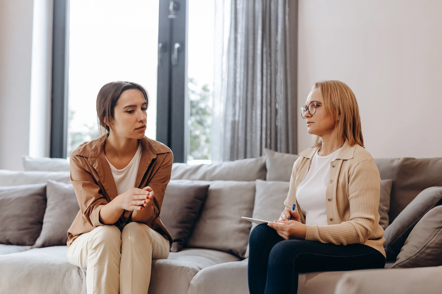 Client meeting with a counselor during a weekly outpatient program session for substance use